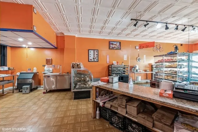 a room with stainless steel appliances lots of counter top space