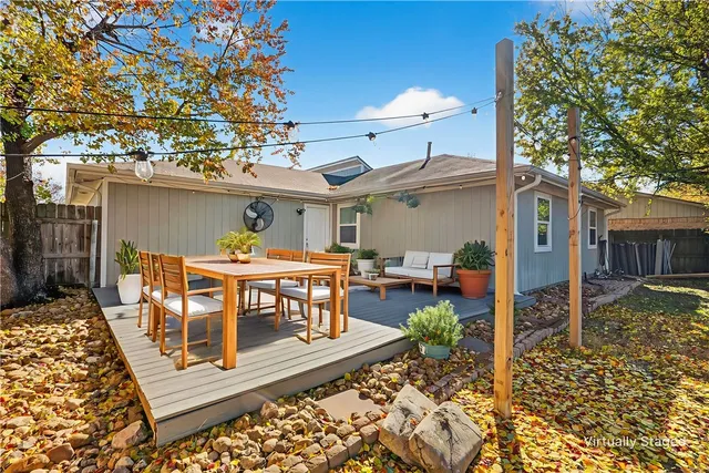 a view of a dinning table and chairs in patio