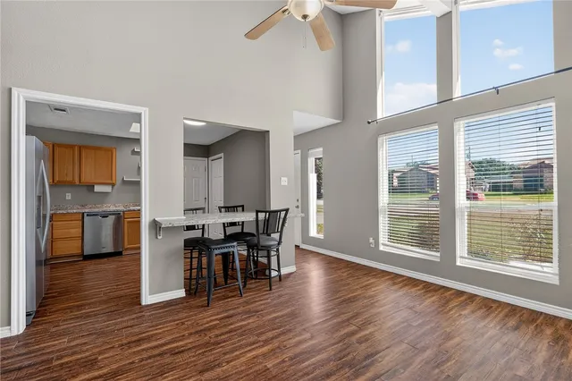 a view of a dining room with furniture and wooden floor