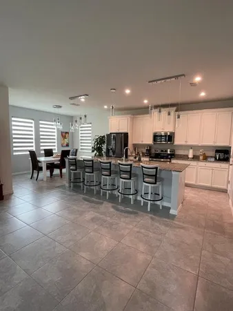 a kitchen with lots of counter space and windows