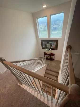 a kitchen with lots of counter top space and chairs