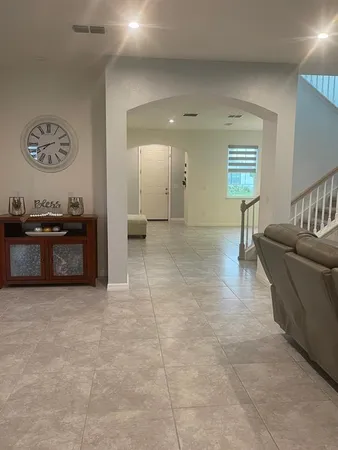 a view of a dining room with furniture and window