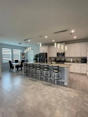 a kitchen with a table and chairs in it
