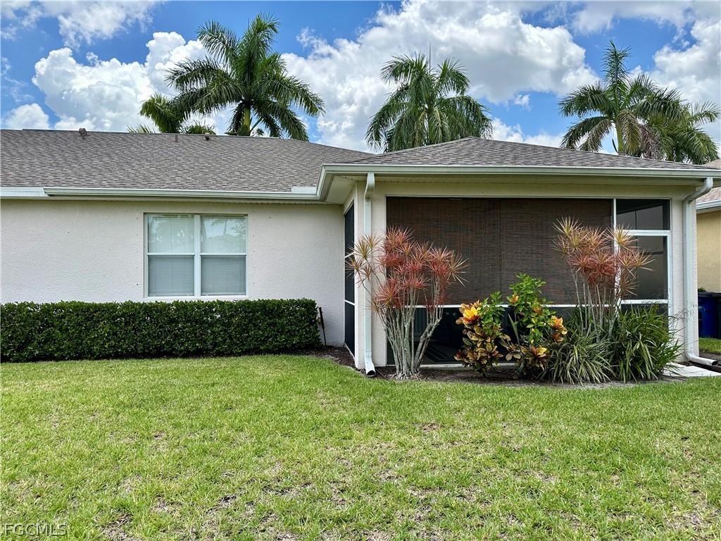 14122 Danpark Loop Fort Myers, FL 33912 - Photo 13 of 15 a front view of a house with garden