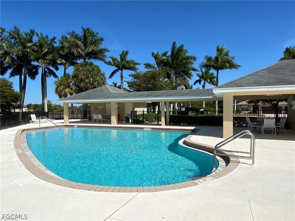 14122 Danpark Loop Fort Myers, FL 33912 - Photo 14 of 15 a view of a swimming pool with lounge chair