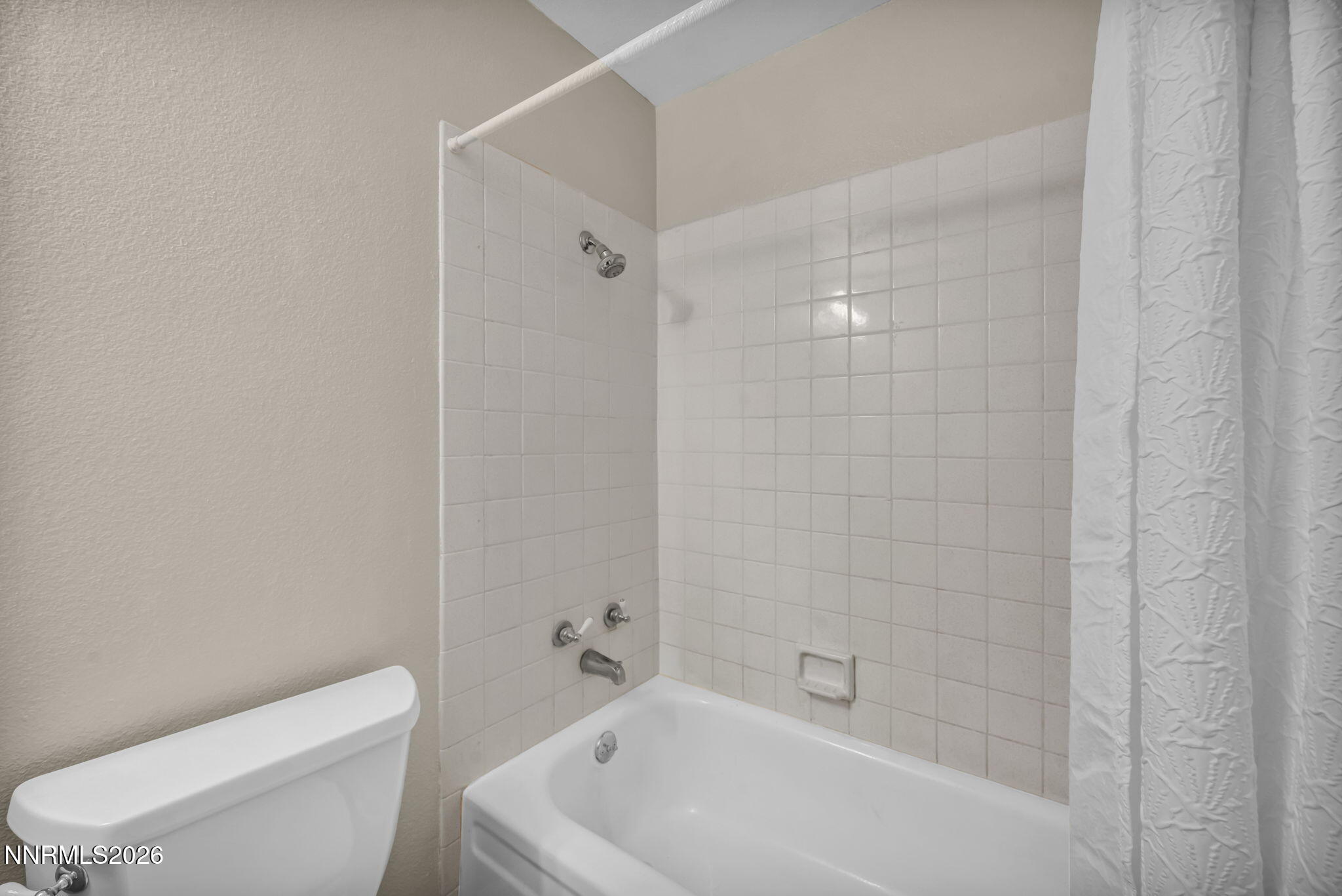 19 Condor Circle Carson City, NV 89701 - Photo 28 of 41 a white bath tub sitting next to a white toilet and a shower