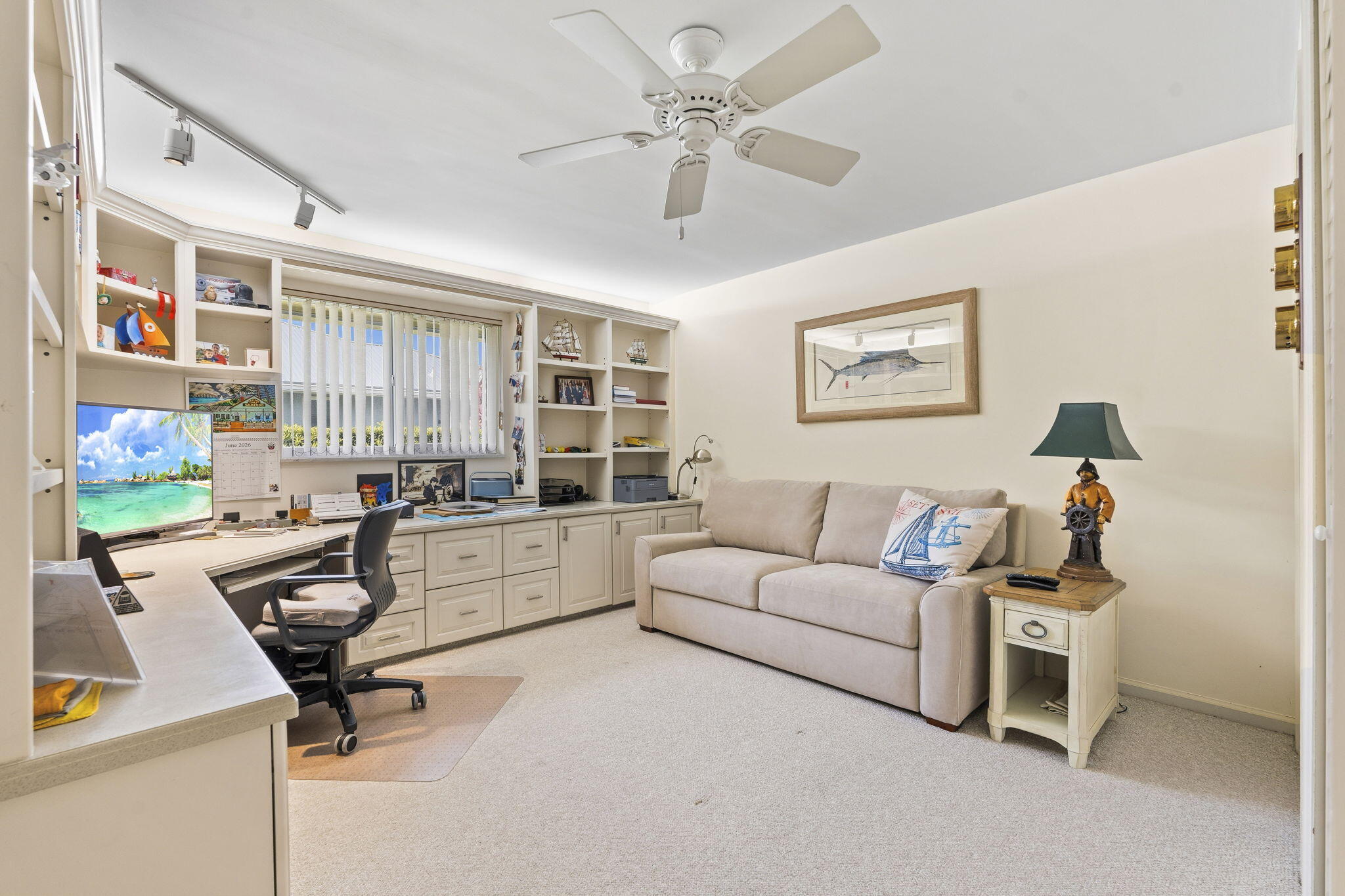 3374 Southeast Fairway East Stuart, FL 34997 - Photo 29 of 65 a living room with furniture gym equipment and a chandelier