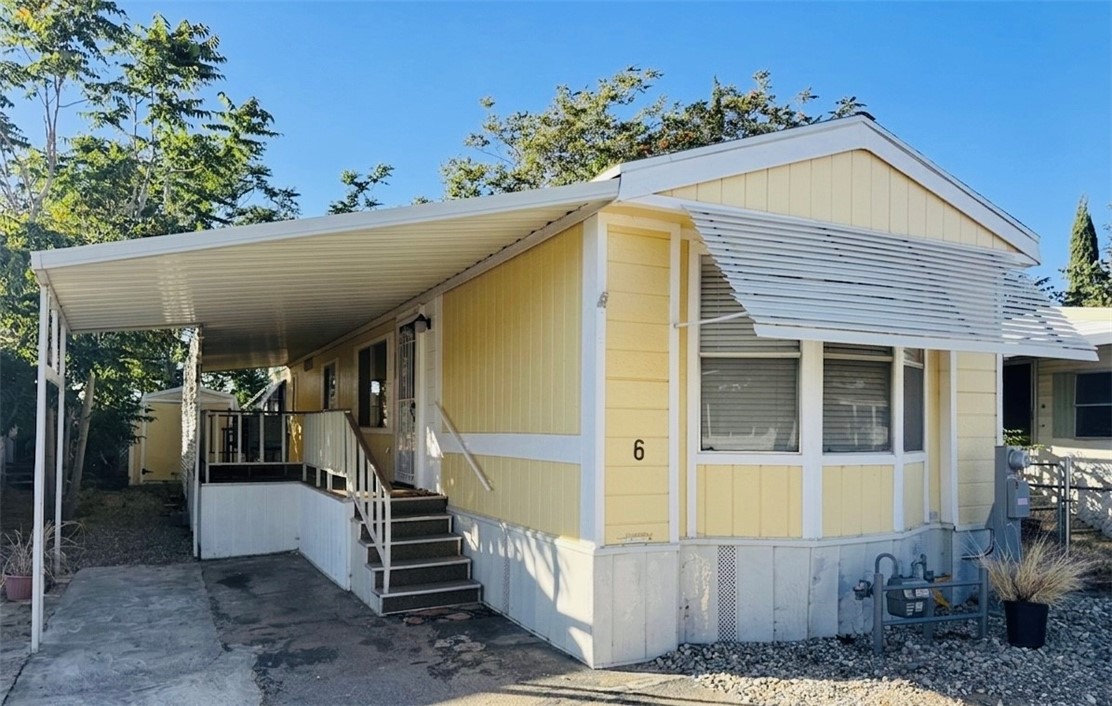 Front of property. Single carport