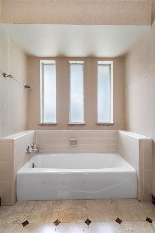 2214 Valley Mill Carrollton, TX 75006 - Photo 25 of 36 a white bath tub sitting in a bathroom