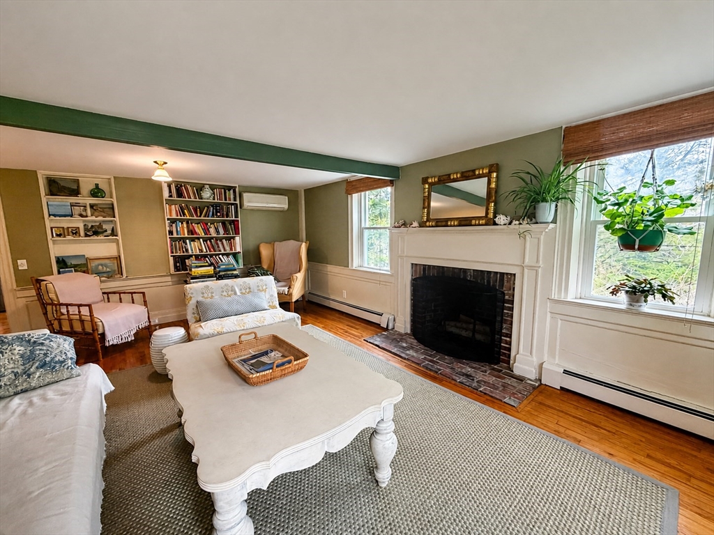 60 Rock Harbor Road Orleans, MA 02653 - Photo 17 of 37 a living room with furniture and a fireplace