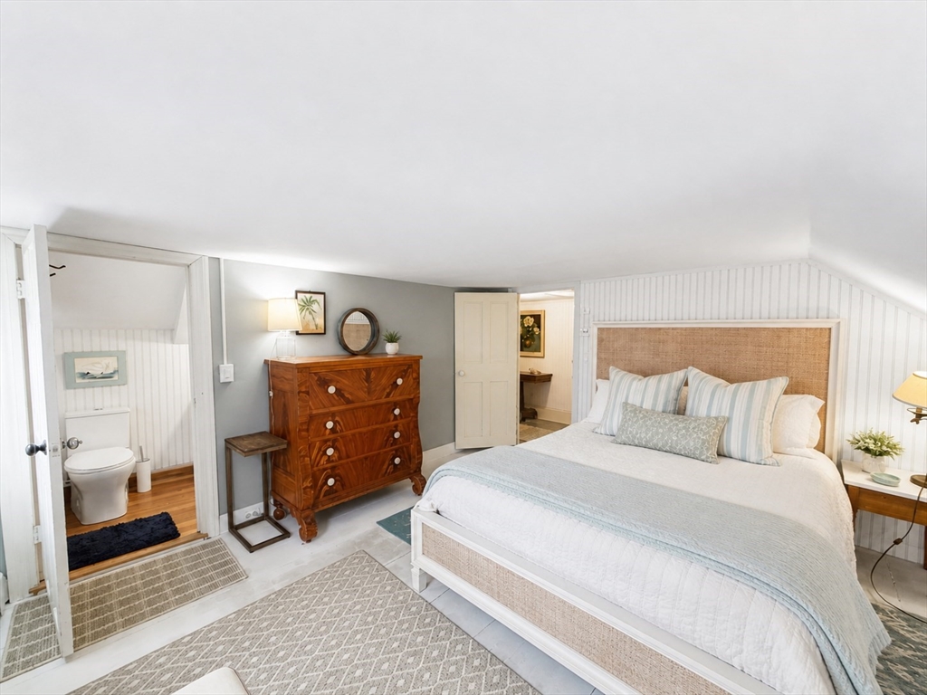 60 Rock Harbor Road Orleans, MA 02653 - Photo 23 of 37 a bedroom with a bed and a dresser