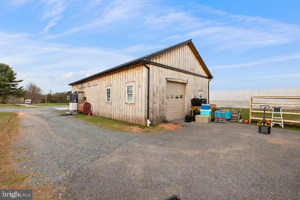 a view of a house with a yard and garage
