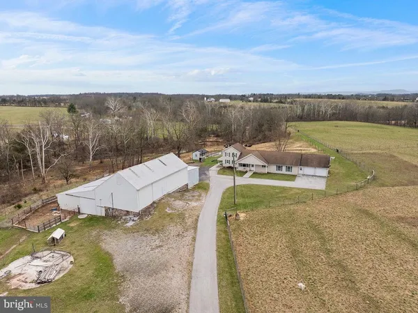 a kitchen with stainless steel appliances granite countertop a stove a sink dishwasher a refrigerator and a stove
