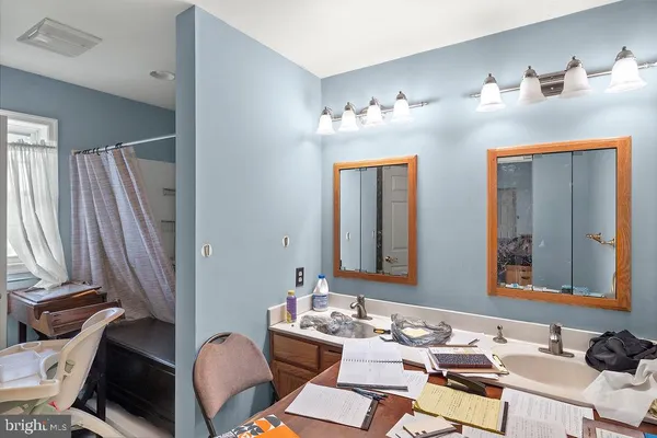 a bedroom with a bed and a dresser in it