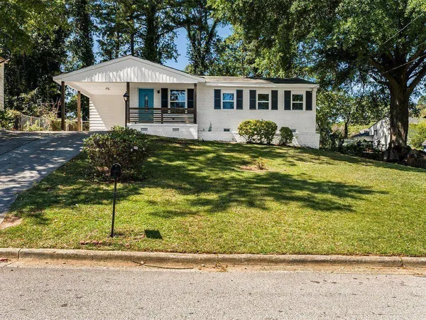 a front view of house with yard having outdoor seating