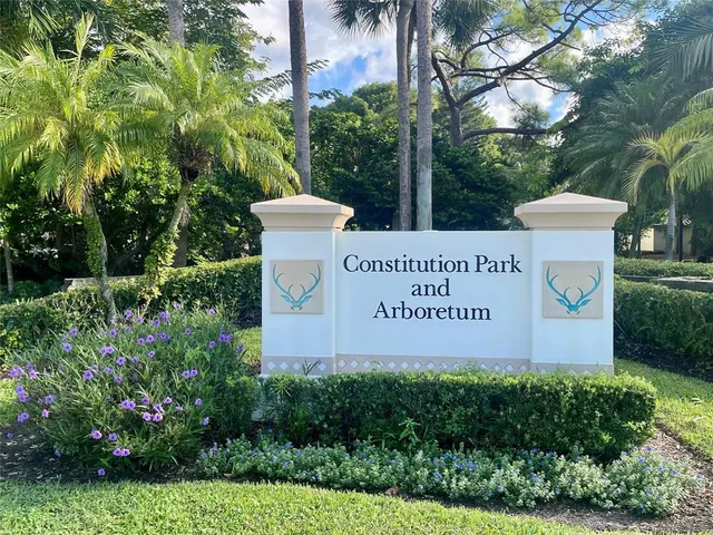 a view of a backyard with sitting area