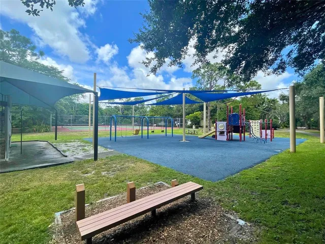 a view of a park with large trees