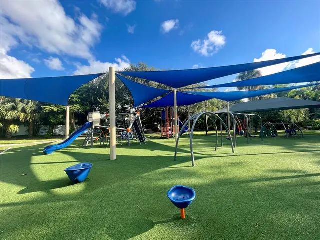 a view of a playground with a patio