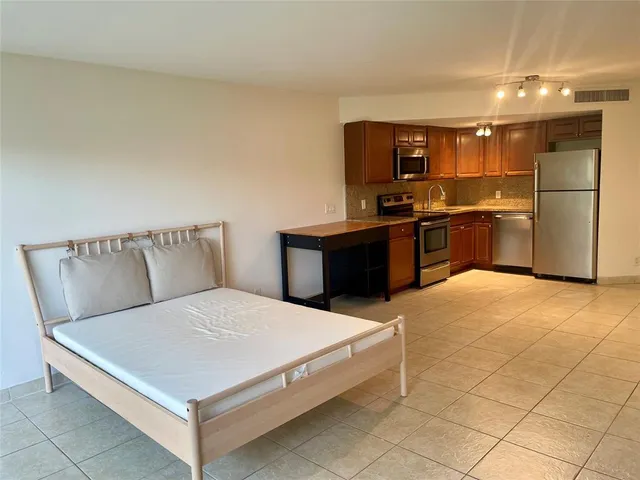 a bedroom with a bed and a table