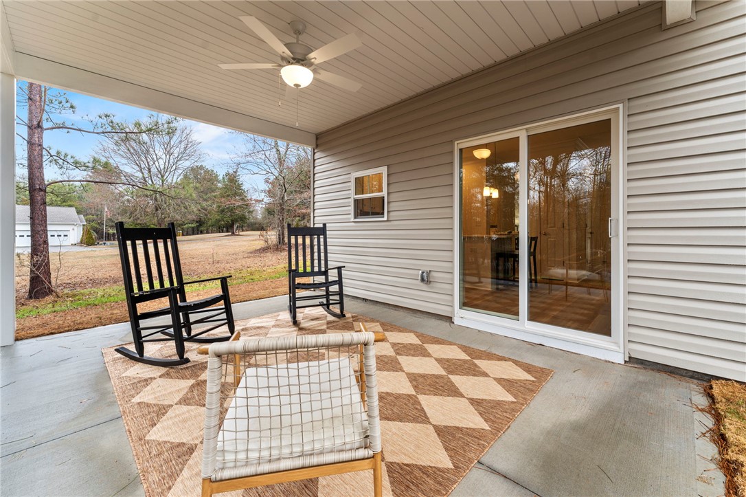 505 Fire Tower Road Williamston, SC 29697 - Photo 35 of 37 This inviting patio offers a serene outdoor retreat, perfect for relaxation and enjoying the natural surroundings.