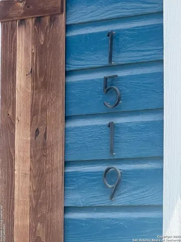 a view of a room with wooden floor and chair