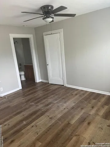 a view of a bathroom with a sink and a mirror
