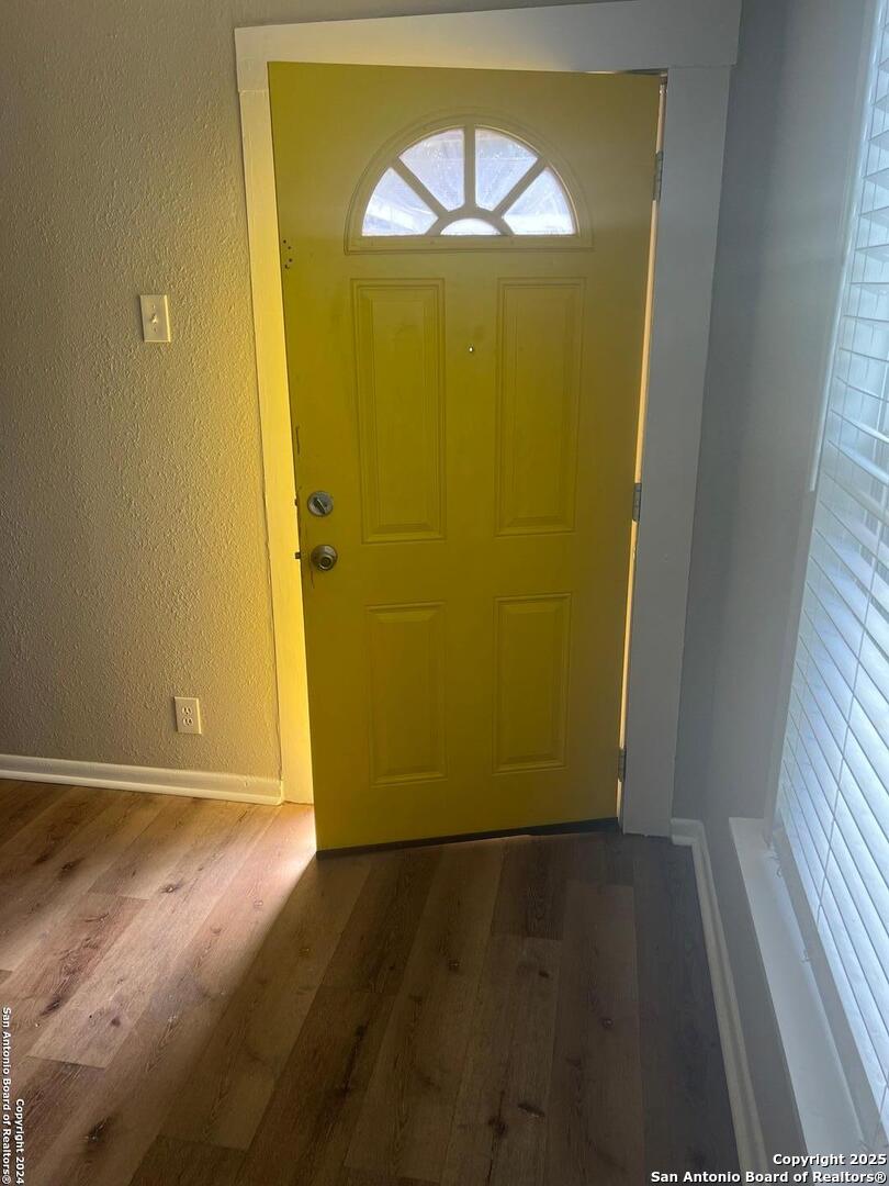 1519 East Southcross, Unit 1 San Antonio, TX 78223 - Photo 9 of 9 an empty room with wooden floor and a window