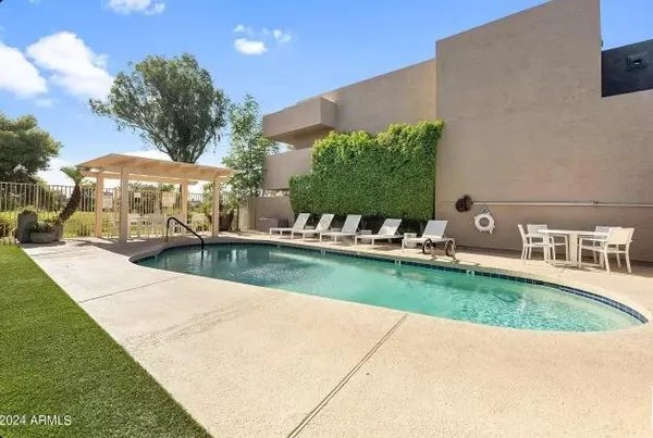 a view of a swimming pool with a patio