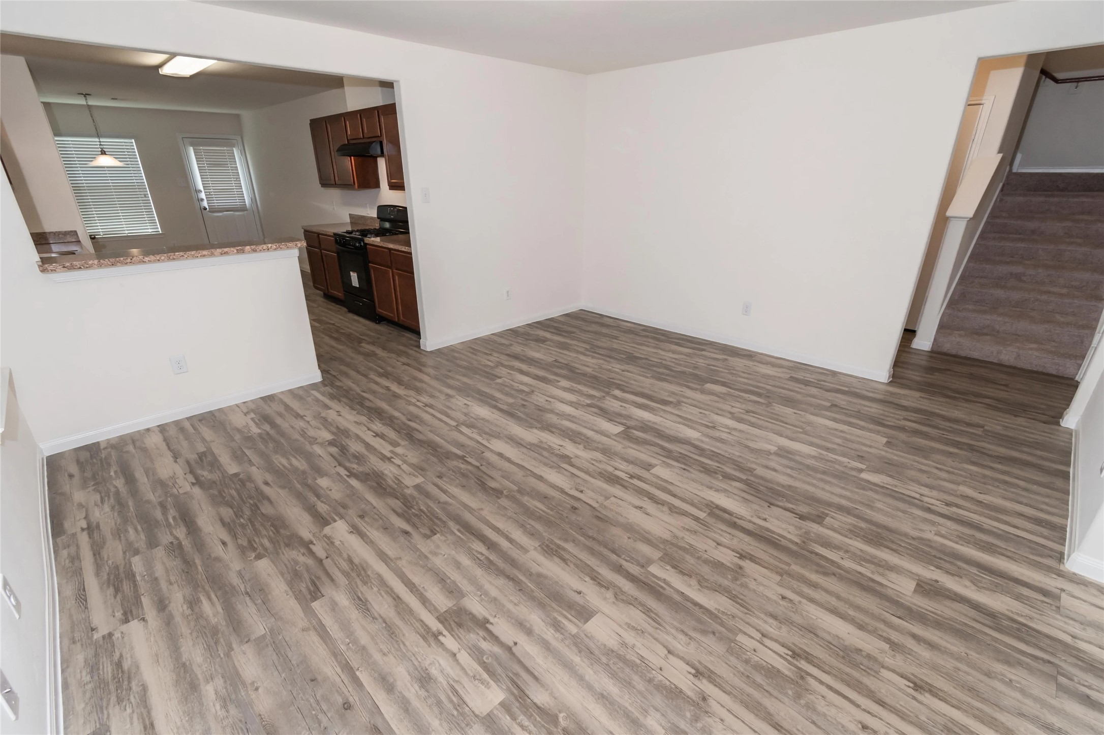 3030 Junction Drive Houston, TX 77045 - Photo 2 of 8 a view of a kitchen from the hallway