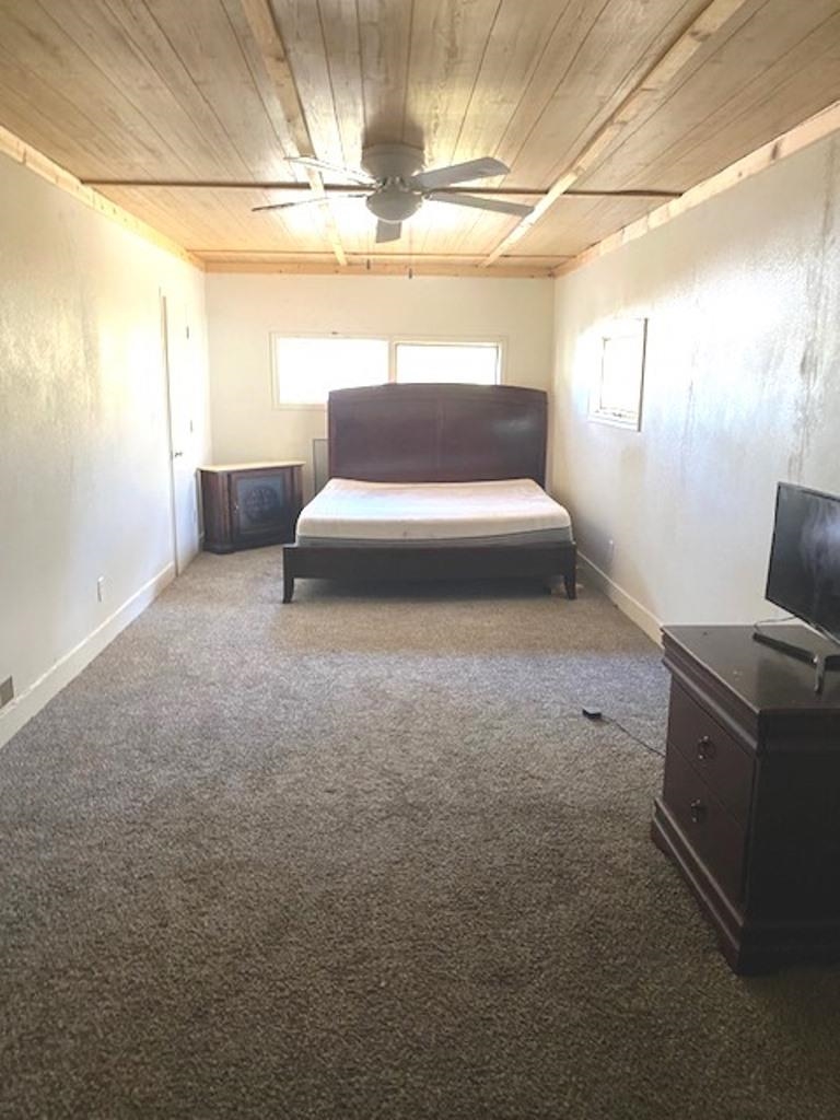 826 South Park Boulevard Freeport, IL 61032 - Photo 12 of 13 a bedroom with a bed and a chandelier