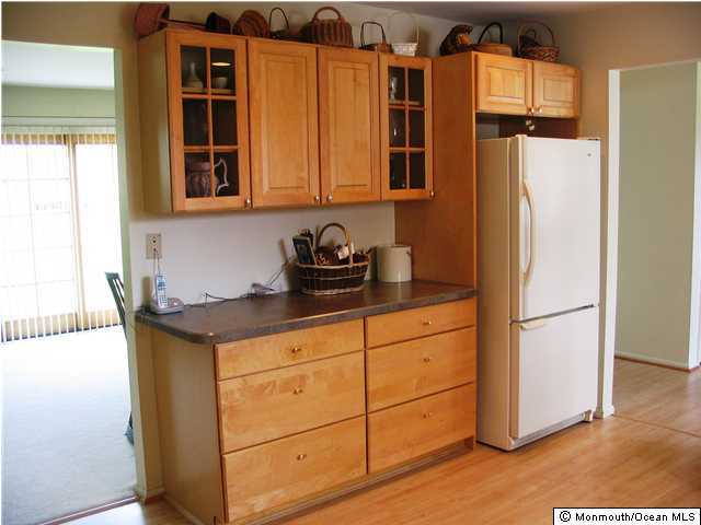159 Rue De Street, Unit A GERMAINE Freehold, NJ 07728 - Photo 3 of 3 a kitchen with stainless steel appliances granite countertop a refrigerator and a cabinets