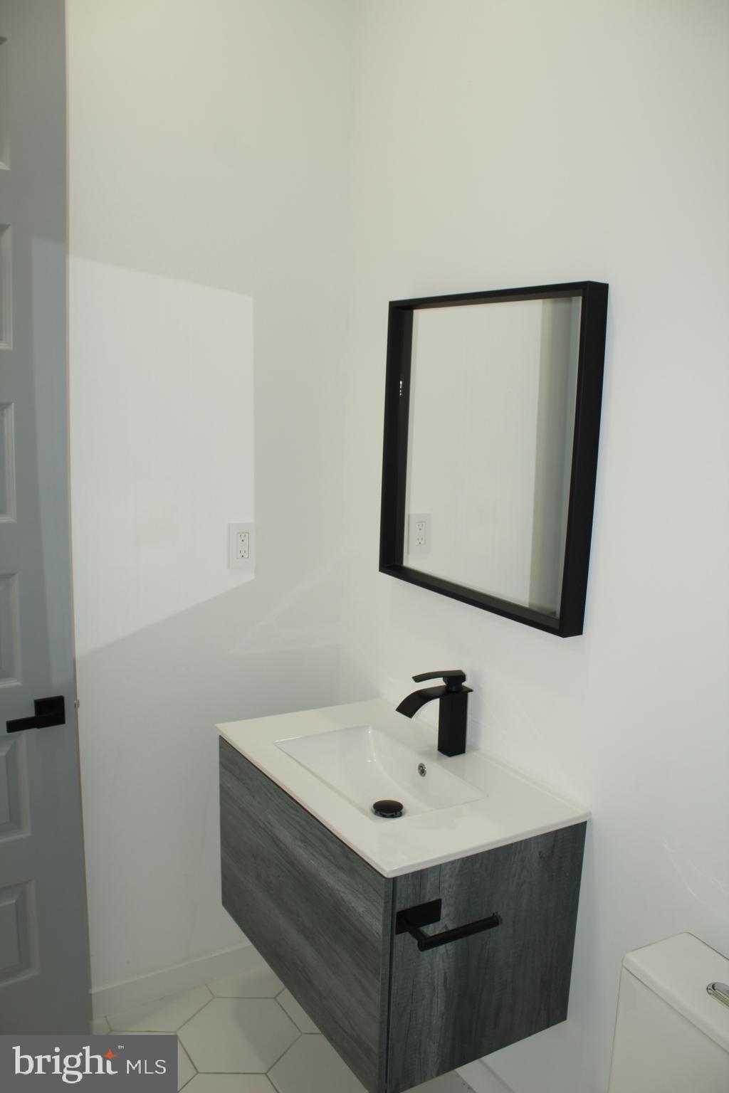 3017 Ridge Avenue, Unit B Philadelphia, PA 19121 - Photo 19 of 29 Sleek modern bathroom with minimalist design.