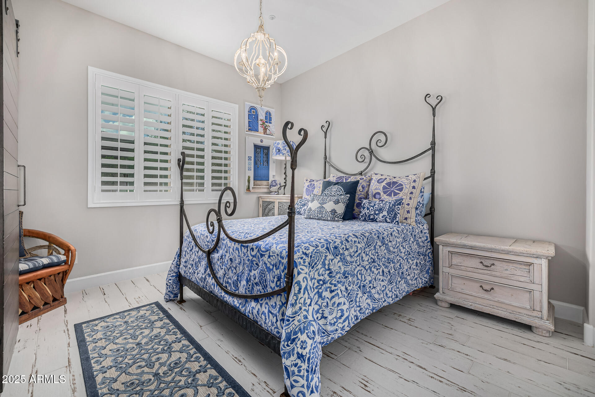 17810 East StockingTrail Rio Verde, AZ 85263 - Photo 22 of 61 a bed room with a bed and a chandelier