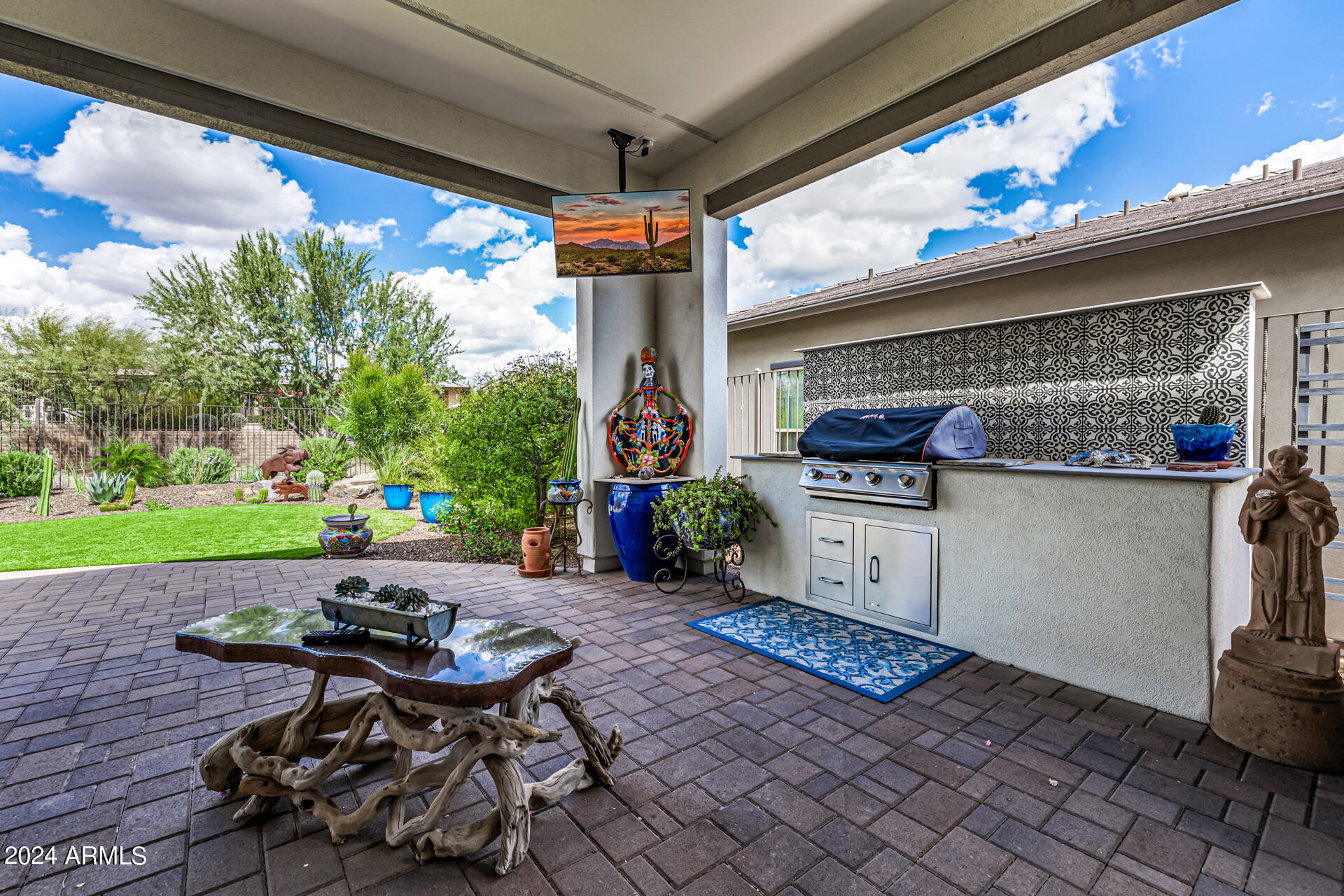 17810 East StockingTrail Rio Verde, AZ 85263 - Photo 30 of 61 a view of a patio with table and chairs and potted plants