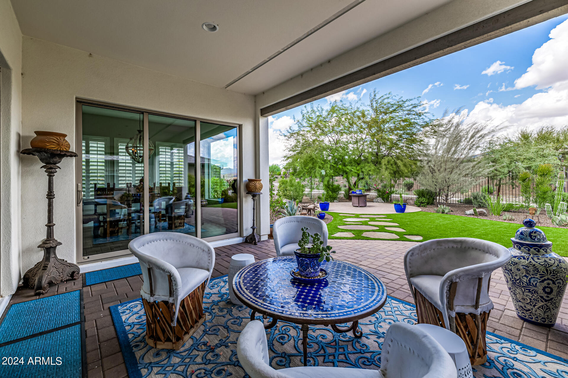 17810 East StockingTrail Rio Verde, AZ 85263 - Photo 31 of 61 a view of a patio with a dining table and chairs