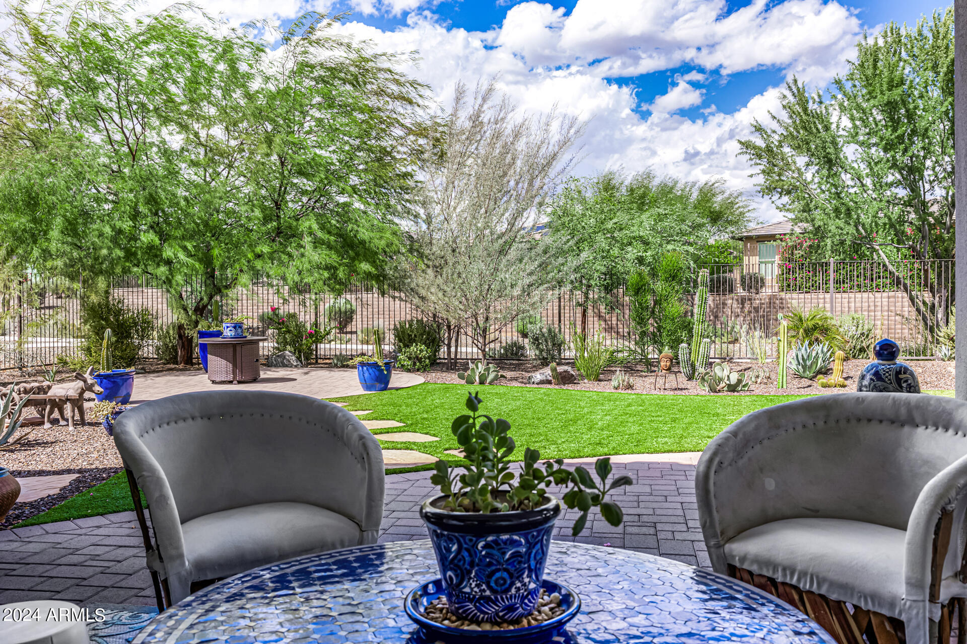 17810 East StockingTrail Rio Verde, AZ 85263 - Photo 33 of 61 a view of a patio with couches and a table and chairs