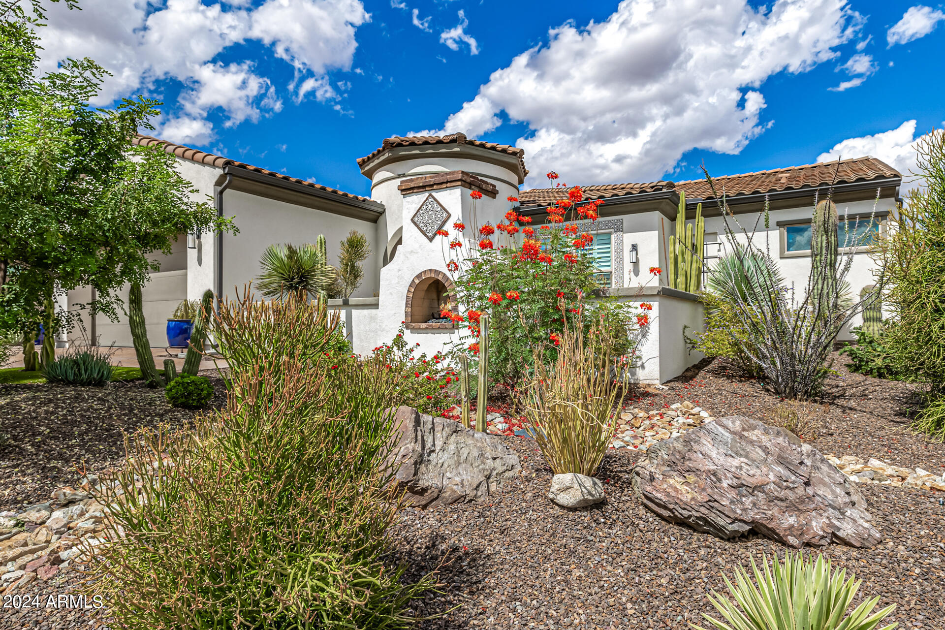 17810 East StockingTrail Rio Verde, AZ 85263 - Photo 6 of 61 a front view of a house with a yard and fountain