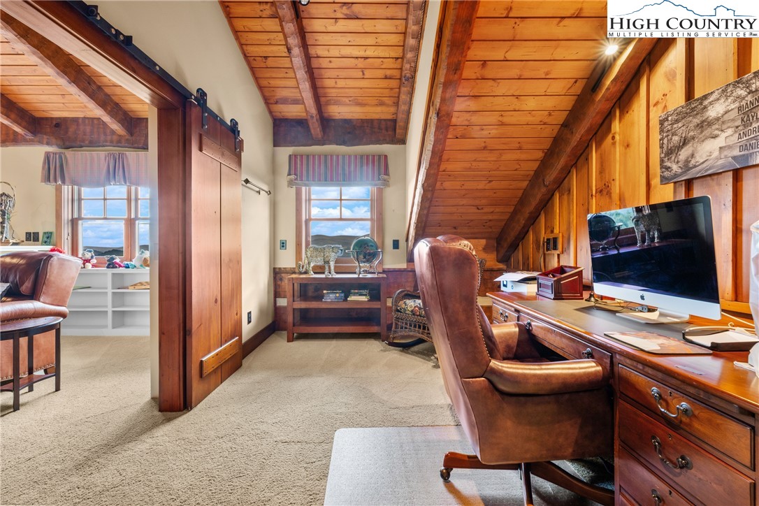 333 Windy Ridge Road Vilas, NC 28692 - Photo 27 of 46 a view of a workspace with furniture and a window