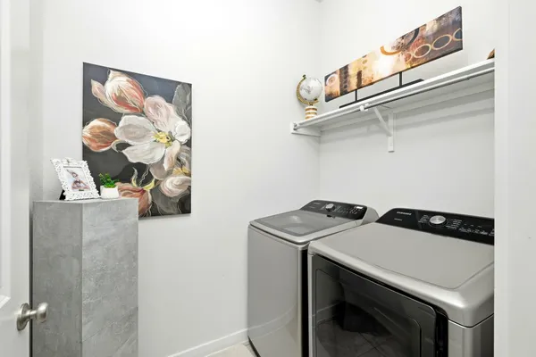 a utility room with dryer and washer