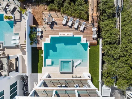 a view of a patio with table and chairs floor to ceiling window with wooden floor