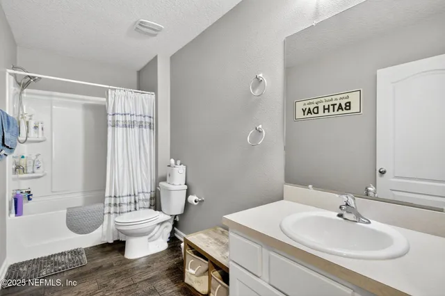 a bedroom with a bed and a cabinets