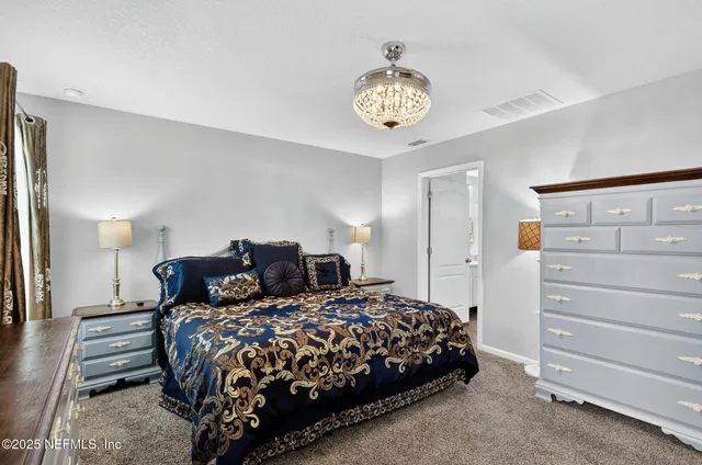 a view of a backyard with furniture and a garden