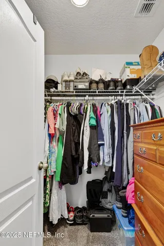 an aerial view of residential houses with outdoor space and street view