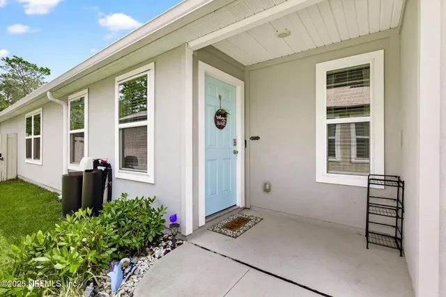 a view of a hallway with furnished wooden floor and a hallway