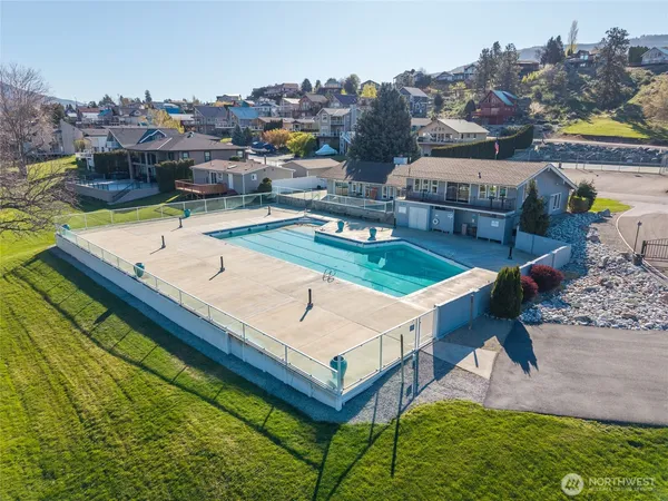 an aerial view of residential houses with outdoor space