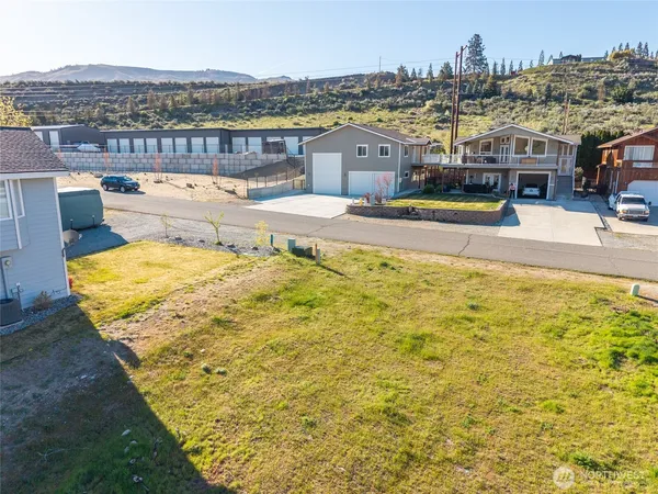 a view of the swimming pool with an outdoor seating