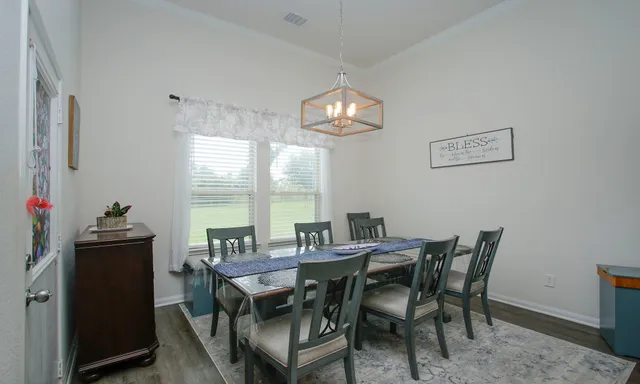 a kitchen with sink stove and microwave