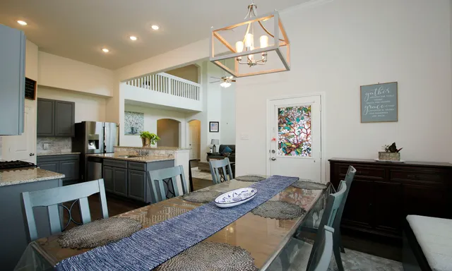 a view of a dining room with furniture and window