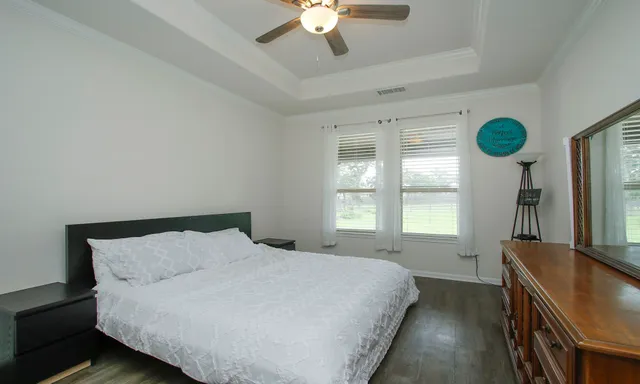a bathroom with a sink mirror and toilet