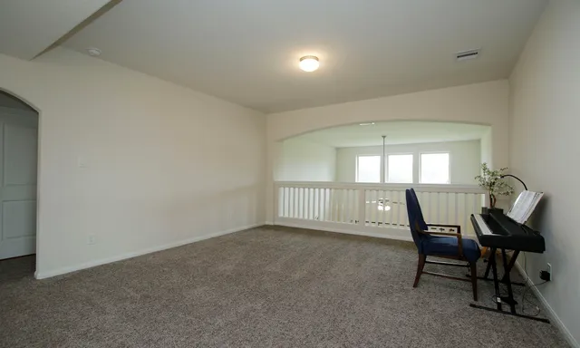a en suite bathroom with a tub double sink and mirror